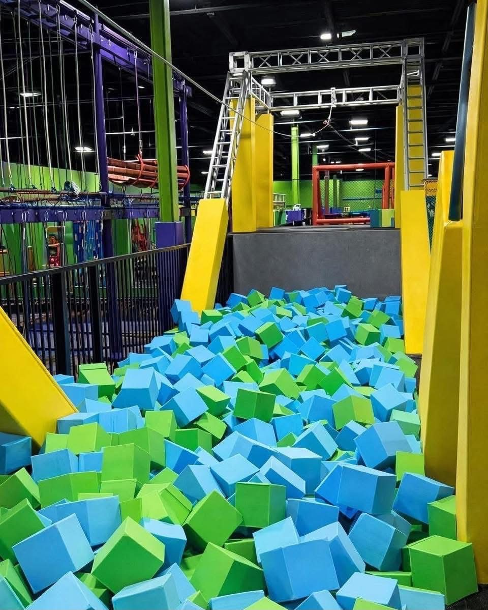 Zip line tower over the foam cube pit at Fun City